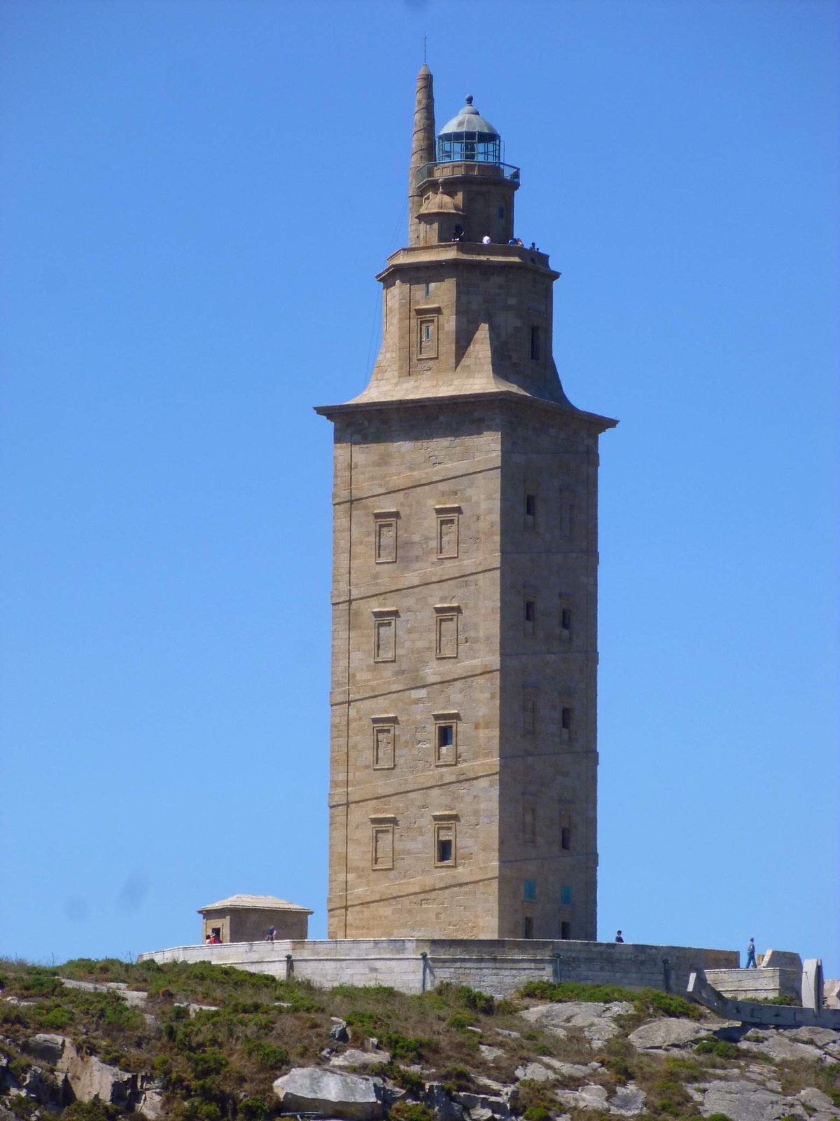 View of Torre de Hércules lighthouse in A Coruña, Spain with blue sky