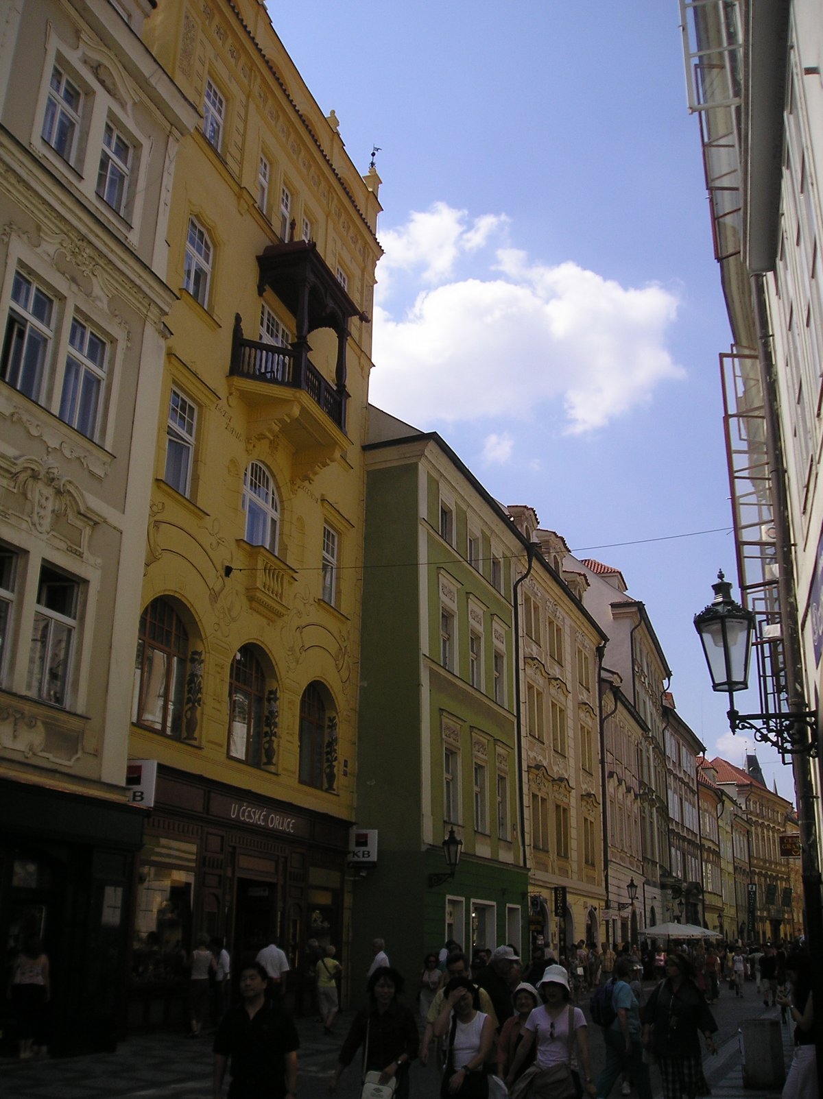 Street view of Celetná in Prague with historic buildings and pedestrians