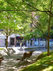 Plaza de Zabalburu in Bilbao with modern buildings and greenery