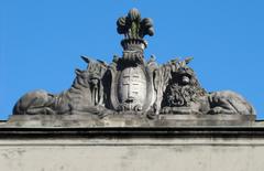 Detailed panoply decoration on the facade of Tyszkiewicz Palace in Warsaw