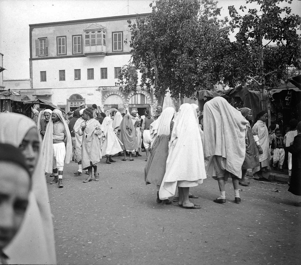 View of Place Halfaouine in Tunis, Tunisia with street activity and urban buildings