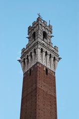 Stone crown architectural detail of the Torre del Mangia tower in Siena