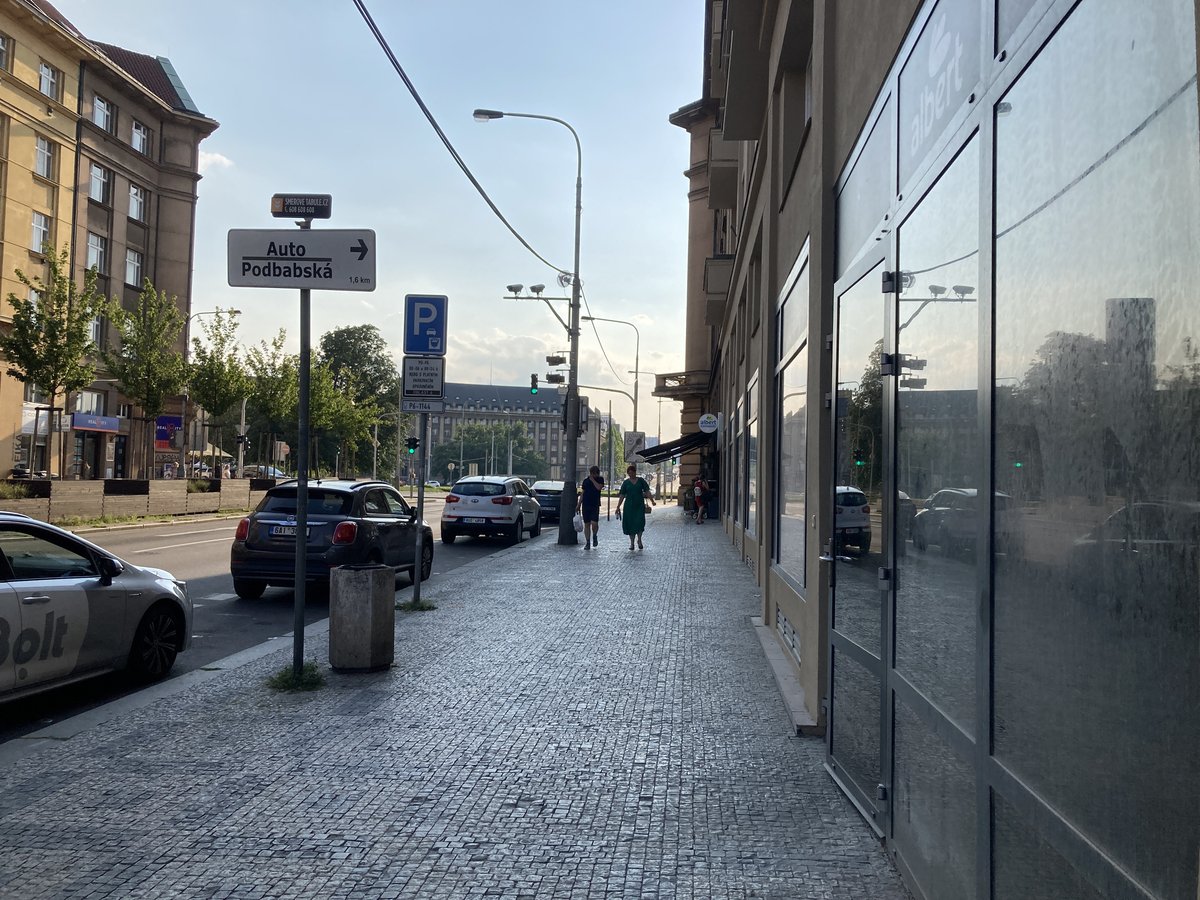 Entrance to Dejvická Metro Station in Prague with stairs and blue signage