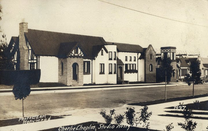Entrance of Chaplin Studios in 1922 with signage and people, vintage postcard