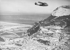 Consolidated PBY Catalina aircraft flying past the North Front of the Rock of Gibraltar during a patrol in March 1942