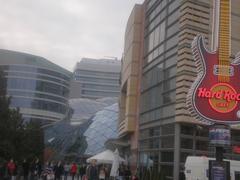 Exterior view of Hard Rock Café Warszawa with shopping centre and Warszawa Central Station in the background