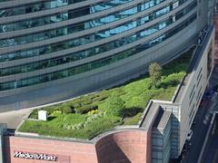View of the rooftop garden of the Złote Tarasy shopping center in Warsaw from the Palace of Culture and Science