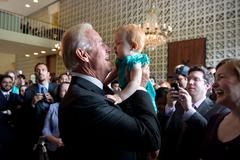 Vice President Joe Biden holding a baby at U.S. Embassy in New Delhi
