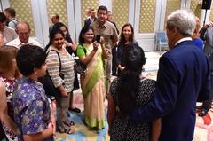 U.S. Secretary of State John Kerry posing with family members of locally hired staff at U.S. Embassy New Delhi