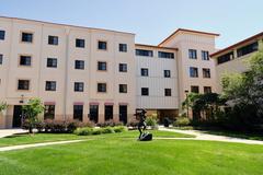 Grass common area with a statue in Summit Village student housing