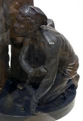 Statue of Thomas Ball's Emancipation Group showing a woman breaking chains with a man behind her and a small child