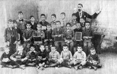 Group of students with their teacher posing in San Antonio de Areco school