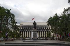 Liwasang Bonifacio park with the burnt facade of Manila Central Post Office in the background