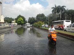 Liwasang Bonifacio gateway to Jones Bridge and Intramuros gates in Manila with historic plaza and river views