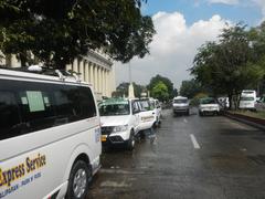 Liwasang Bonifacio gateway plaza in Manila with historical markers and views of Jones Bridge towards Intramuros