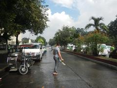 Liwasang Bonifacio gateway and historic plaza in Manila with old stone arches and surrounding trees
