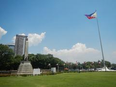 Rizal Park landmarks including Jose Rizal National Monument, Independence Flagpole, and historical markers in Manila, Philippines