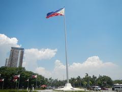 Rizal Park historical landmarks including Jose Rizal National Monument, Independence Flagpole, and multiple historical markers in Manila, Philippines