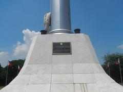 Jose Rizal National Monument and historical markers at Rizal Park in Manila showing execution site memorial, Independence Flagpole, and markers of Philippine republic history
