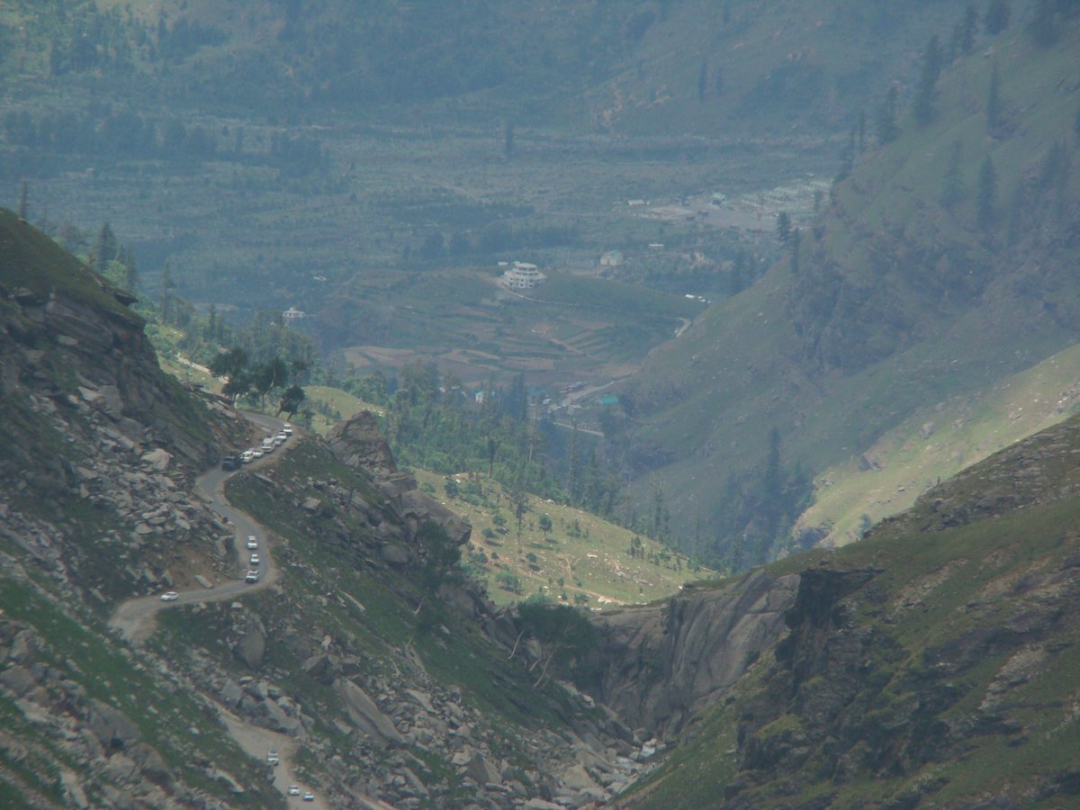 Scenic view of Solang Valley on the way to Rohtang Pass with lush green hills and clear blue sky