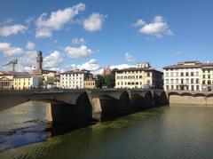 Ponte alle Grazie bridge in Florence Italy viewed from east side over Arno river at sunset