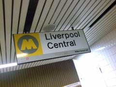 Liverpool Central train station sign with red background and white lettering