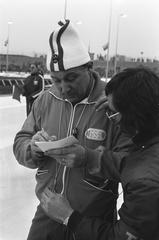 Ice skating competition at the first ISSL World Cup for professionals at De Uithof in The Hague on January 6, 1973, featuring skater number 10 Anton Huiskes with trainer in black and white