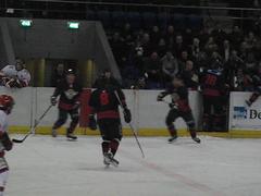 HYS The Hague ice hockey players in blue uniforms playing against Groningen Grizzlies in white uniforms at De Uithof arena