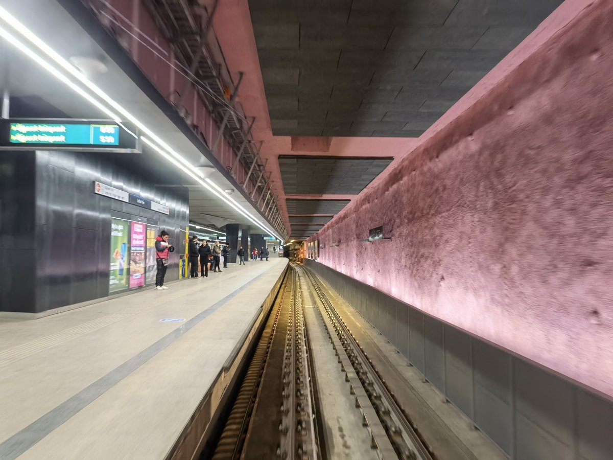 Budapest Lehel tér M3 metro station platform with waiting passengers and trains