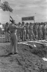 Major Reverend D. Sybesma, army chaplain of KNIL, commemorating fallen soldiers at Antjol military cemetery in Indonesia, 1946