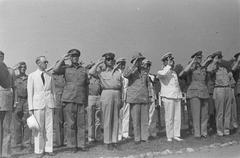 Authorities saluting at the WWII honoree ceremony in Batavia, 1946