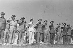 Authorities saluting at WWII executed soldiers memorial in Batavia, Indonesia, September 14, 1946