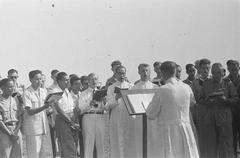 Black and white photo of a male choir singing in Batavia, Indonesia on September 14, 1946