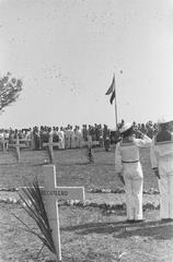 Black and white photograph of a tribute ceremony for executed WWII soldiers at Antjol cemetery in Batavia, Indonesia, September 14, 1946