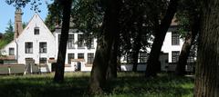 North side of the inner courtyard at the Begijnhof in Brugge showing beguines houses numbered 14, 16, and 18
