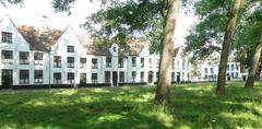 West side courtyard view of Begijnhof in Brugge with historic buildings and greenery