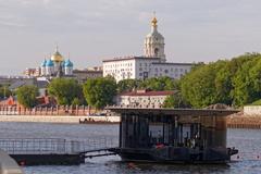 Moscow Derbenyovskaya Embankment ferry terminal on the river with boats and modern buildings in background