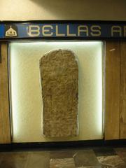 Replica of Yaxchilan Mayan lintel displayed at Metro Bellas Artes in Mexico City showing richly dressed Mayan dignitary