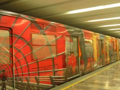 Mexico City metro train decorated with city-related images at Metro Bellas Artes station