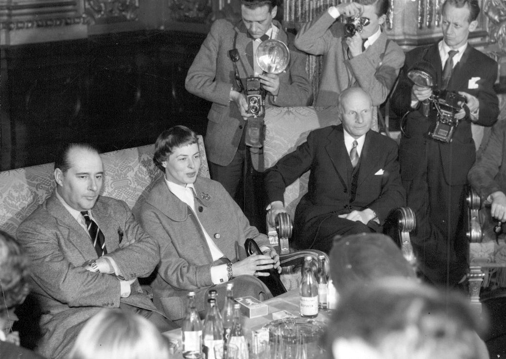 Ingrid Bergman smiling warmly at the press in the golden foyer of the Royal Opera in Stockholm