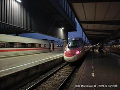 EuroCity train to Zurich HB departing from Munich HB platform 27 with an ICE train on platform 26