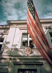 American Embassy in Warsaw with shattered window and American flag during 1939 German siege