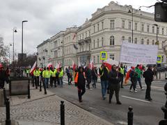 Protest of farmers in Warsaw with people holding banners and tractors