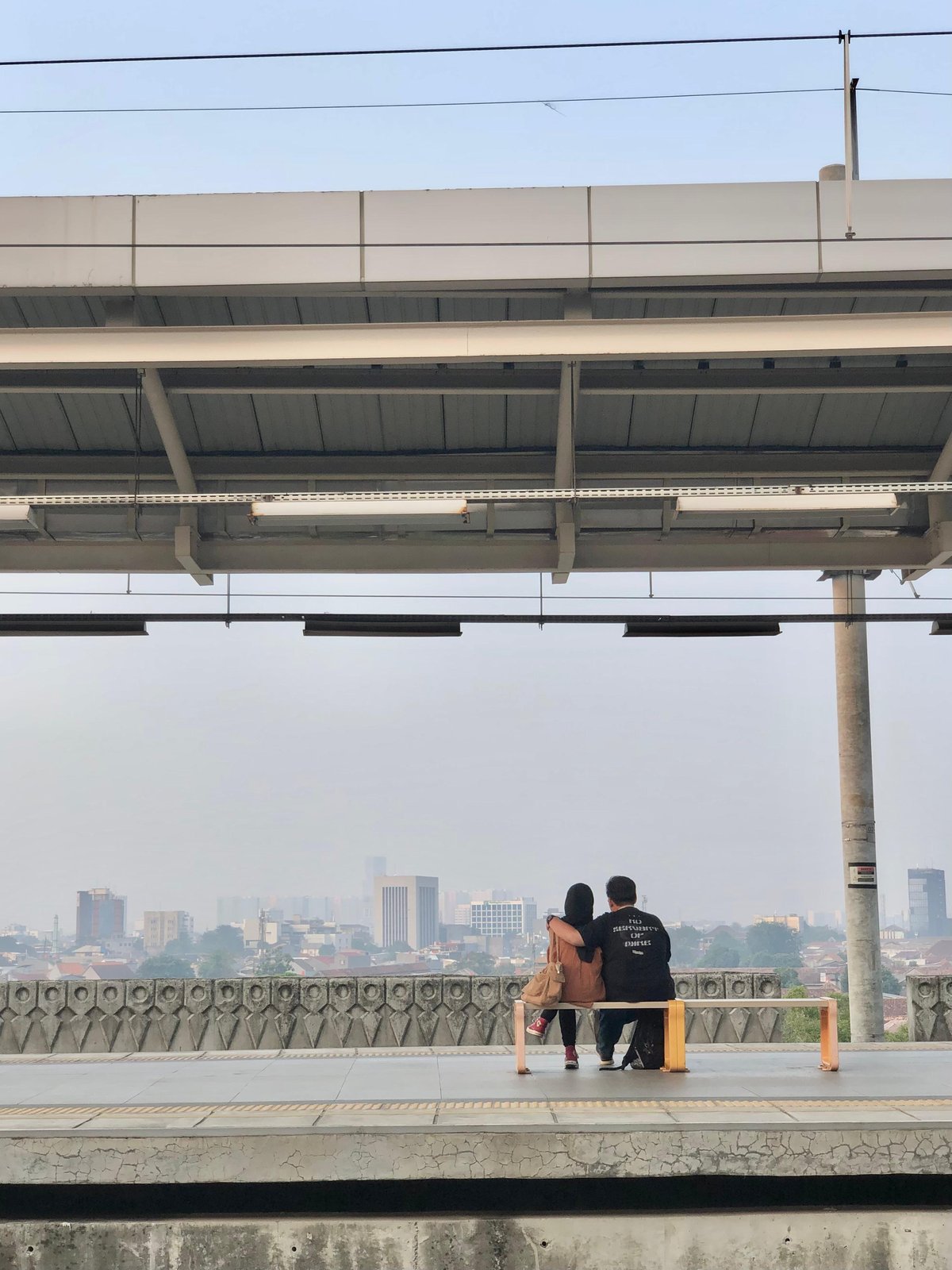Sunset view at Manggarai Station with people waiting