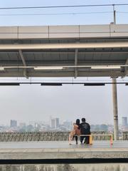 Sunset view at Manggarai Station with people waiting