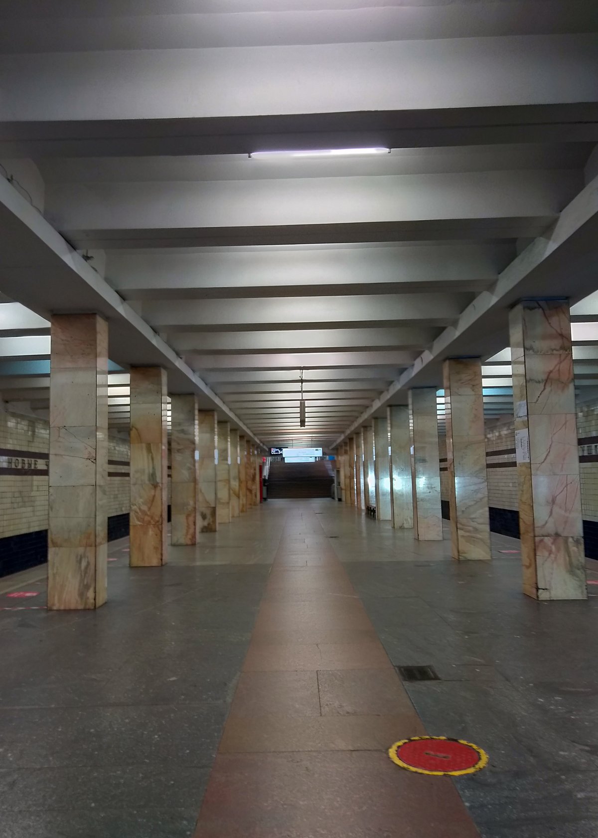 Noviye Cheryomushki Metro Station during COVID-19 pandemic with empty platform and protective measures