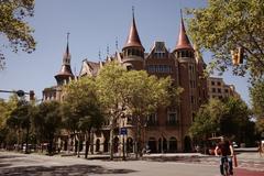 Aerial view of Barcelona cityscape with distinctive architecture and Mediterranean coastline