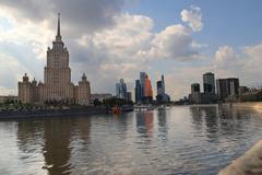 Hotel Ukraina in Moscow reflecting classic architecture with the Moskva River in foreground