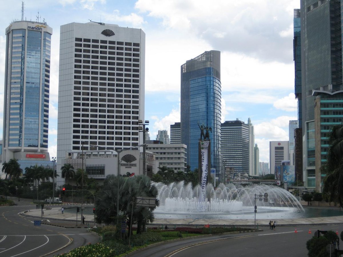 Jakarta cityscape with high-rise buildings under clear blue sky