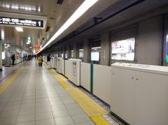 Karasuma Oike subway station platform in Kyoto Japan with passengers waiting